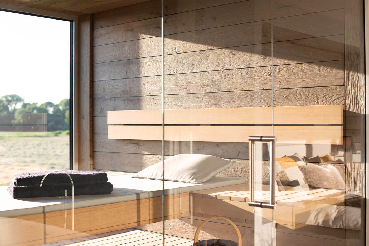 Innensauna mit Außenblick 4 designsauna glas mondsee corso 6 | corso saunamanufaktur